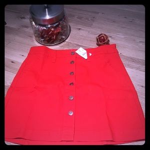 Canvas button front skirt in dark poppy